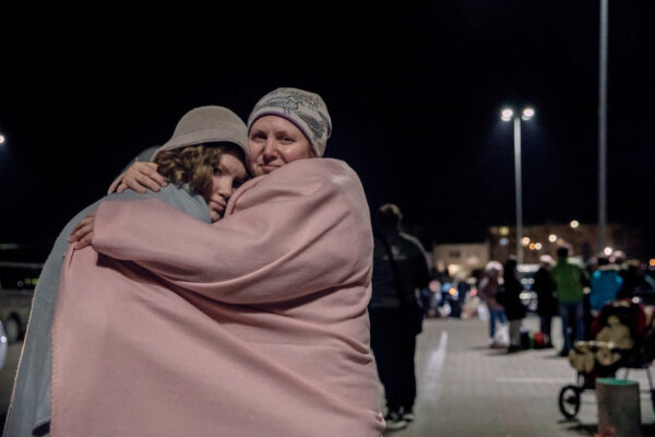&nbsp;Kotove Snizhenne, 45-years-old and her daughter Kotevyne, 12, stand outside a transit center in Przemysl, Poland, on March 2, 2022.
The situation was tensed, with the bombs and fighting when they left. The grand-mother is stranded in her town, surrounded by Russian forces.
Kotove says : "My daughter say everything,and she saw the images of Russian tanks in her grand mother's town. She can't stop crying and is frightened all the time." The children used to study in Lviv and the mother says she now worries for their education, as "Everything is under depression in Ukraine now. If the war continues there will benothing left. Everything is linked with the war now. It is a bloody, monstruous war."