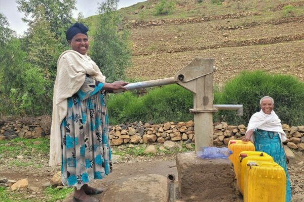 Bosse, 40, and Yalga, 70, fetching water at a water pump, installed by the community together with CARE.

Climate change is affecting communities in Ethiopia. The country is facing the worst drought in the last 40 years. Women and girls have to walk long distances to find water. Livestock are dying and the fields are not producing enough crops. Livelihoods are at risk.&nbsp;
&nbsp;
It is the women and girls that need to go and find water. Due to the drought, it can take up to two hours of walking to find a source. Girls drop out of school, because they have to walk the whole day to fetch water for their families.&nbsp;
&nbsp; &nbsp; &nbsp; &nbsp;
After walking for hours, the women and girls find a small water hole or a stream that still has water. The water is dirty. Livestock also drink from it. The water is full of their feces and excrements. &ldquo;Little worms live in the water, that suck the blood out of your mouth. Drinking water from an unprotected source made us very ill. Diarrhea and vomiting are the most common,&rdquo; explains Bosse, 40. Drinking contaminated water full of bacteria has serious health effects that can compromise the immune system severely, cause infections and sometimes even lead to death.&nbsp;
&nbsp; &nbsp;
That is why it is crucial to have access to a protected water source. In water projects, CARE supports the communities by building wells and water pumps close to the villages. The area around the water pump is protected by the community. &ldquo;We plant trees and other plants. With gabions we build barriers to control the water flow. No livestock is allowed to enter this area. Before we had this protected environment, we had enough water for a month. But now the ground water is rising, and we already have enough for six months. We understand the importance and will continue planting more trees to have enough water for the whole year,&rdquo; explains Bosse.


&ldquo;Having access to water changed our community. Women have less household chores and girls can go back to school and receive an education instead of fetching water the whole day. We changed our mindset. Now we treat the trees in the protected environment like our children,&rdquo; reflects Yalga, 70.&nbsp;